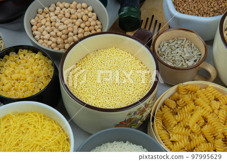 Yellow millet in bowl. Shopping and storage products. Vegetarian organic product. 97995629