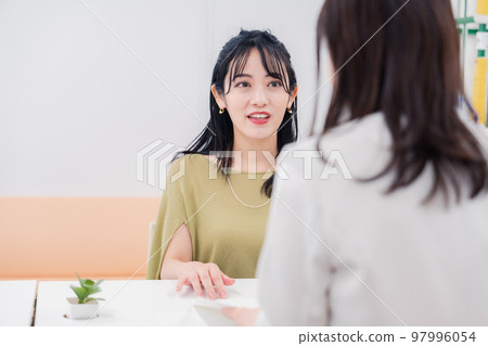 A woman at the counter 97996054