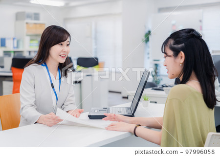 A woman at the counter A woman at the counter 97996058