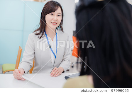 A woman at the counter A woman at the counter 97996065