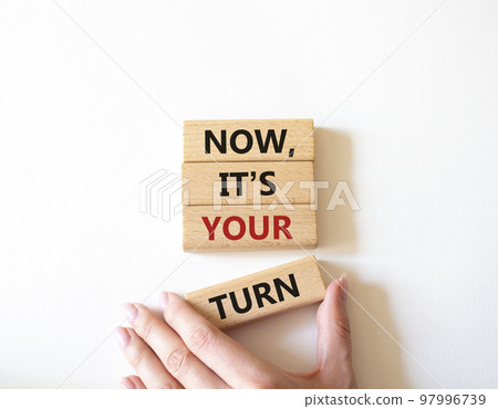 Now it's your turn symbol. Concept words Now it's your turn on wooden blocks. Beautiful white background. Businessman hand. Business and Now it's your turn me concept. Copy space Now it's your turn symbol. Concept words Now it's your turn on wooden blocks. Beautiful white background. Businessman hand. Business and Now it's your turn me concept. Copy space 97996739