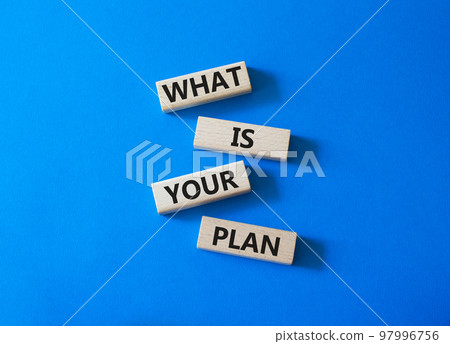 What is your plan symbol. Concept words What is your plan on wooden blocks. Beautiful blue background. Business and What is your plan concept. Copy space 97996756