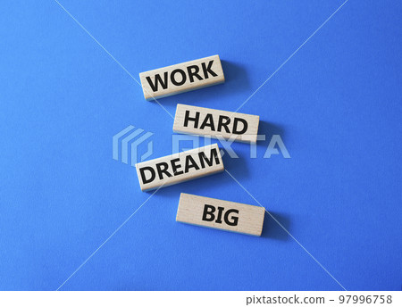 Work and dream symbol. Wooden blocks with words Work Hard Dream Big. Beautiful blue background. Business and Work Hard Dream Big concept. Copy space. 97996758