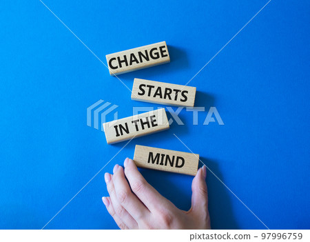 Change starts in the mind symbol. Concept words Change starts in the mind on wooden blocks. Beautiful blue background. Businessman hand. Business and Change starts in the mind concept. Copy space 97996759