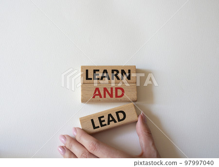 Learn and lead symbol. Concept words Learn and lead on wooden blocks. Beautiful white background. Businessman hand. Business and Learn and lead concept. Copy space. Learn and lead symbol. Concept words Learn and lead on wooden blocks. Beautiful white background. Businessman hand. Business and Learn and lead concept. Copy space. 97997040