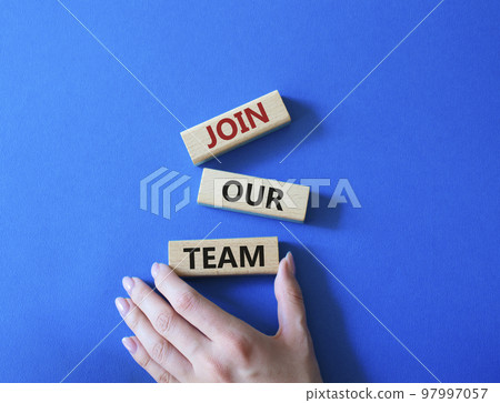 Join our team symbol. Wooden blocks with words Join our team. Beautiful blue background. Businessman hand. Business and Join our team concept. Copy space. 97997057