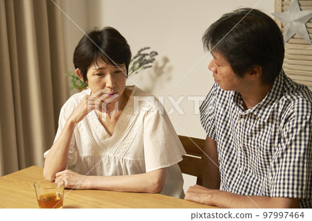 Middle-aged woman depressed at home 97997464