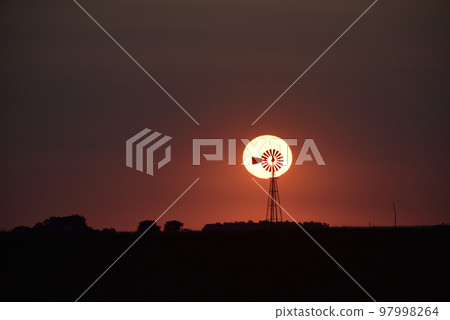 Windmill in countryside at sunset, Pampas, Patagonia,Argentina. 97998264
