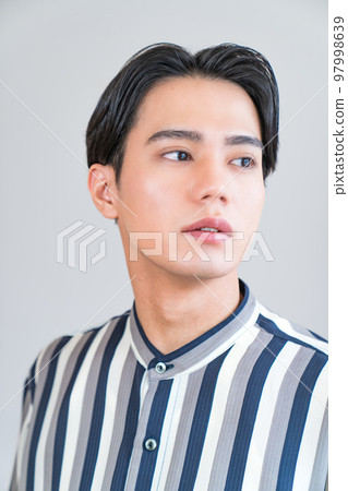 Fashion portrait of a cool man, young, fresh, make-up, permanent make-up, Korean trend 97998639