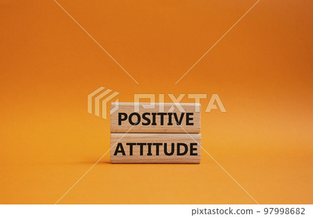 Positive attitude symbol. Concept words Positive attitude on wooden blocks. Beautiful orange background. Business and Positive attitude concept. Copy space. Positive attitude symbol. Concept words Positive attitude on wooden blocks. Beautiful orange background. Business and Positive attitude concept. Copy space. 97998682