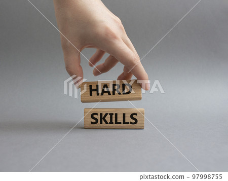 Hard skills symbol. Wooden blocks with words Hard skills. Beautiful grey background. Businessman hand. Businessman hand. Business and Hard skills concept. Copy space Hard skills symbol. Wooden blocks with words Hard skills. Beautiful grey background. Businessman hand. Businessman hand. Business and Hard skills concept. Copy space 97998755