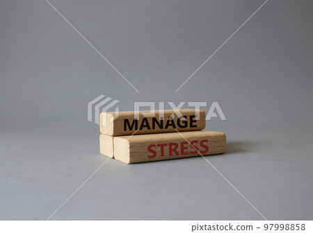 Manage stress symbol. Concept word Manage stress on wooden blocks. Beautiful grey background. Business and Manage stress concept. Copy space Manage stress symbol. Concept word Manage stress on wooden blocks. Beautiful grey background. Business and Manage stress concept. Copy space 97998858