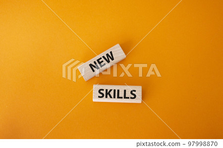 New skills symbol. Wooden blocks with words New skills. Beautiful orange background. Business and New skills concept. Copy space. New skills symbol. Wooden blocks with words New skills. Beautiful orange background. Business and New skills concept. Copy space. 97998870