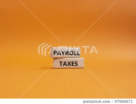 Payroll taxes symbol. Concept word Payroll taxes on wooden blocks. Beautiful orange background. Business and Payroll taxes concept. Copy space Payroll taxes symbol. Concept word Payroll taxes on wooden blocks. Beautiful orange background. Business and Payroll taxes concept. Copy space 97998871