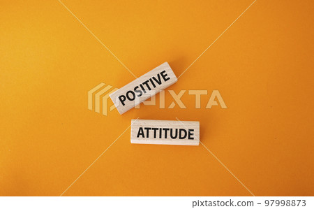 Positive attitude symbol. Concept words Positive attitude on wooden blocks. Beautiful orange background. Business and Positive attitude concept. Copy space. Positive attitude symbol. Concept words Positive attitude on wooden blocks. Beautiful orange background. Business and Positive attitude concept. Copy space. 97998873