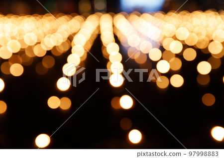 Abstract golden bokeh from candle light on black background. Abstract golden bokeh from candle light on black background. 97998883