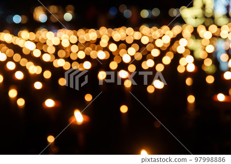 Abstract golden bokeh from candle light on black background. Abstract golden bokeh from candle light on black background. 97998886