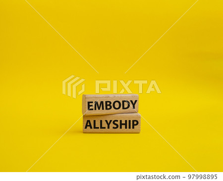 Embody Allyship symbol. Concept word Embody Allyship on wooden blocks. Beautiful yellow background. Business and Embody Allyship concept. Copy space Embody Allyship symbol. Concept word Embody Allyship on wooden blocks. Beautiful yellow background. Business and Embody Allyship concept. Copy space 97998895