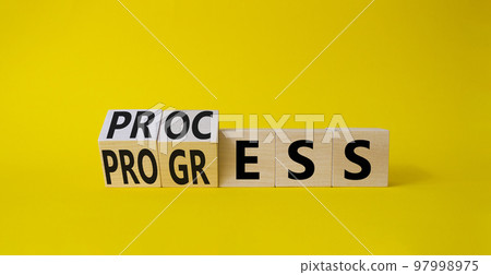 Process and Progress symbol. Turned wooden cubes with words Process and Progress. Beautiful yellow background. Business and Process and Progress concept. Copy space 97998975