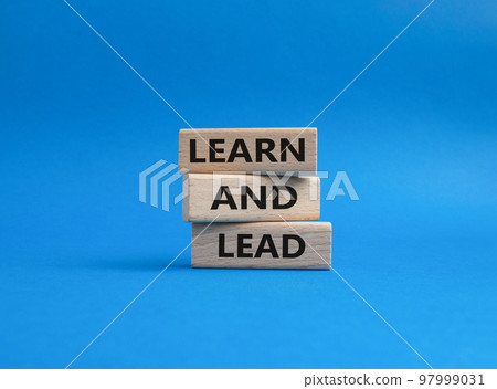 Learn and lead symbol. Concept words 'Learn and lead' on wooden blocks. Beautiful blue background. Business and Learn and lead concept. Copy space. Learn and lead symbol. Concept words 'Learn and lead' on wooden blocks. Beautiful blue background. Business and Learn and lead concept. Copy space. 97999031