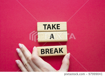 Take a break symbol. Concept words Take a break on wooden blocks. Beautiful red background. Businessman hand. Business and Take a break concept. Copy space. Take a break symbol. Concept words Take a break on wooden blocks. Beautiful red background. Businessman hand. Business and Take a break concept. Copy space. 97999041