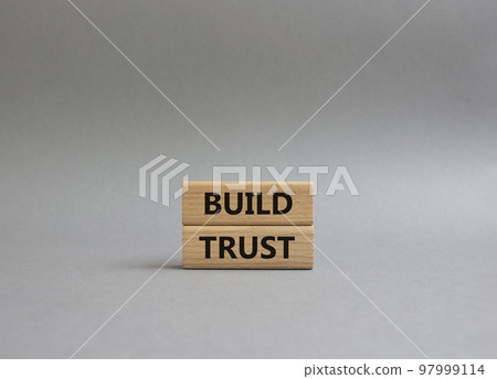 Build trust symbol. Wooden blocks with words Build trust. Beautiful grey background. Business and Build trust concept. Copy space. 97999114