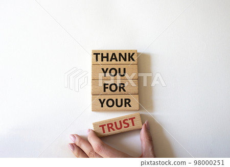 Thank you for your trust symbol. Wooden blocks with words Thank you for your trust. Beautiful white background. Businessman hand. Business and Thank you for your trust concept. Copy space 98000251