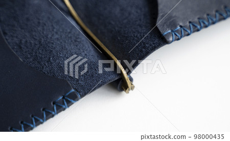 Blue men's business genuine leather money clip on a white surface. Accessories. 98000435