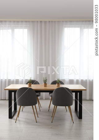Modern room interior with chairs and table Modern room interior with chairs and table 98001033