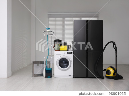 Refrigerator and different household appliances in room 98001035