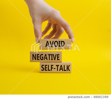 Avoid negative self-talk symbol. Concept words Avoid negative self-talk on wooden blocks. Beautiful yellow background. Businessman hand. Business and Avoid negative self-talk concept. Copy space. Avoid negative self-talk symbol. Concept words Avoid negative self-talk on wooden blocks. Beautiful yellow background. Businessman hand. Business and Avoid negative self-talk concept. Copy space. 98001399