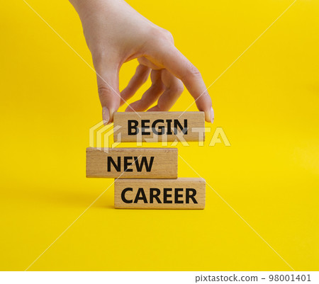 Begin new career symbol. Concept word Begin new career on wooden blocks. Businessman hand. Beautiful yellow background. Business and Begin new career concept. Copy space Begin new career symbol. Concept word Begin new career on wooden blocks. Businessman hand. Beautiful yellow background. Business and Begin new career concept. Copy space 98001401