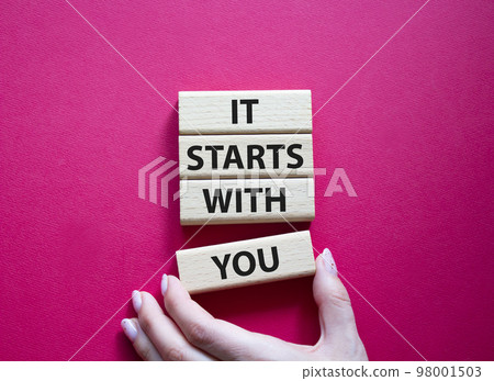 It starts with you symbol. Wooden blocks with words It starts with you. Beautiful red background. Businessman hand. Business and It starts with you concept. Copy space. It starts with you symbol. Wooden blocks with words It starts with you. Beautiful red background. Businessman hand. Business and It starts with you concept. Copy space. 98001503