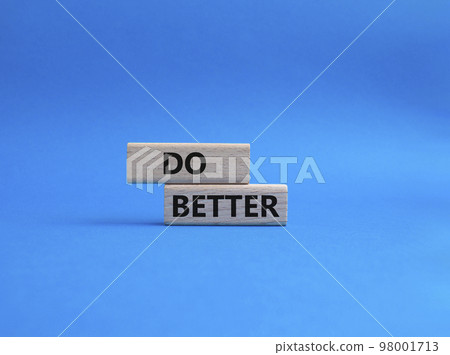 Do better symbol. Wooden blocks with words Do better. Beautiful blue background. Business and Do better concept. Copy space Do better symbol. Wooden blocks with words Do better. Beautiful blue background. Business and Do better concept. Copy space 98001713