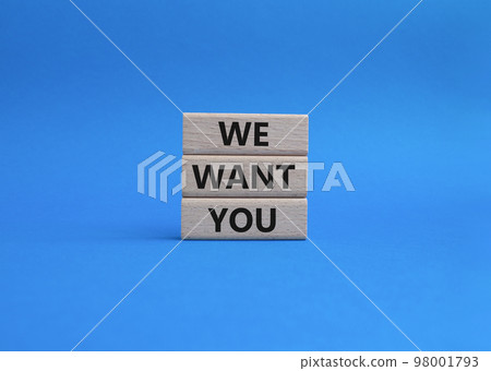 We want you symbol. Concept words We want you on wooden blocks. Beautiful blue background. Business and We want you concept. Copy space. 98001793
