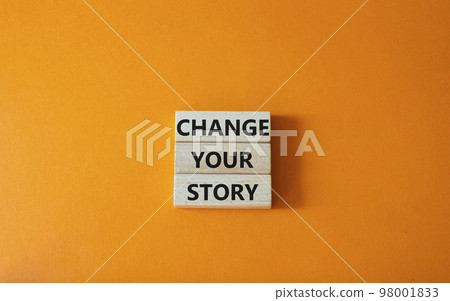 Change your story symbol. Concept word Change your story on wooden blocks. Beautiful orange background. Business and Change your story concept. Copy space Change your story symbol. Concept word Change your story on wooden blocks. Beautiful orange background. Business and Change your story concept. Copy space 98001833