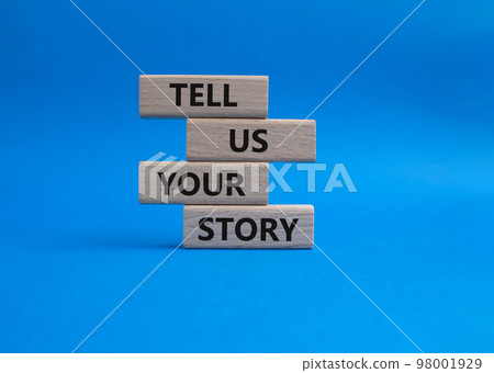 Tell us your story symbol. Concept words Tell us your story on wooden blocks. Beautiful blue background. Business and Tell us your story concept. Copy space. 98001929