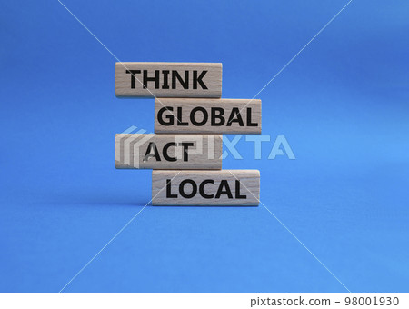 Think global act local symbol. Wooden blocks with words Think global act local . Beautiful blue background. Business and Think global act local concept. Copy space. 98001930
