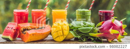 Rainbow from smoothies. Watermelon, papaya, mango, spinach and dragon fruit. Smoothies, juices, beverages, drinks variety with fresh fruits on a wooden table BANNER, long format Rainbow from smoothies. Watermelon, papaya, mango, spinach and dragon fruit. Smoothies, juices, beverages, drinks variety with fresh fruits on a wooden table BANNER, long format 98002227