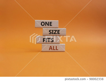 One size fits all symbol. Concept words One size fits all on wooden blocks. Beautiful orange background. Business and One size fits all concept. Copy space. 98002338