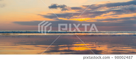 Panorama, Banner, long format of Sunset on the Kuta beach with reflection in the water on the island of Bali Panorama, Banner, long format of Sunset on the Kuta beach with reflection in the water on the island of Bali 98002487