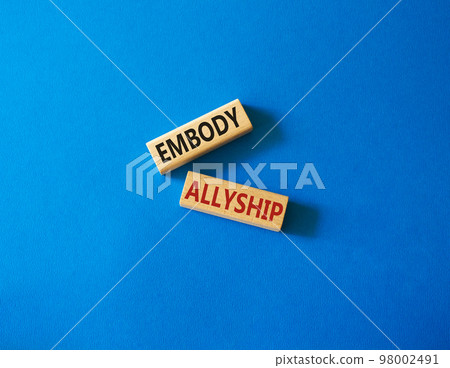 Embody Allyship symbol. Concept word Embody Allyship on wooden blocks. Beautiful blue background. Business and Embody Allyship concept. Copy space Embody Allyship symbol. Concept word Embody Allyship on wooden blocks. Beautiful blue background. Business and Embody Allyship concept. Copy space 98002491