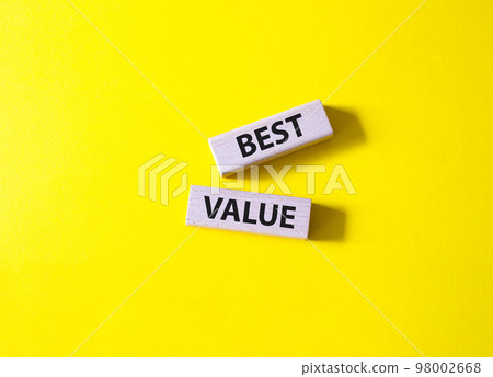 Best value symbol. Wooden blocks with words Best value. Beautiful yellow background. Business and Best value concept. Copy space. 98002668