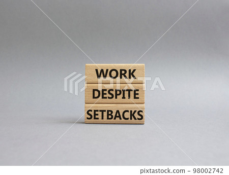 Work despite setbacks symbol. Wooden blocks with words Work despite setbacks. Beautiful grey background. Business and Work despite setbacks concept. Copy space. Work despite setbacks symbol. Wooden blocks with words Work despite setbacks. Beautiful grey background. Business and Work despite setbacks concept. Copy space. 98002742