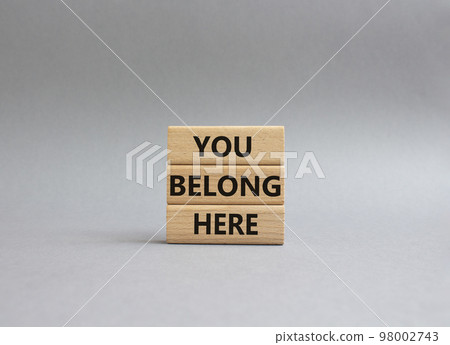 You belong here symbol. Wooden blocks with words You belong here. Beautiful grey background. Business and You belong here setbacks concept. Copy space. You belong here symbol. Wooden blocks with words You belong here. Beautiful grey background. Business and You belong here setbacks concept. Copy space. 98002743