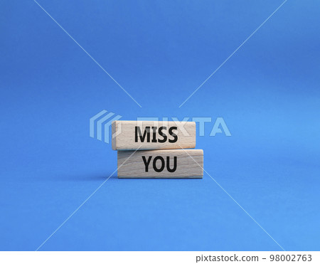 Miss you. Concept word Miss you on wooden cubes. Beautiful blue background. Business and Miss you concept. Copy space. Miss you. Concept word Miss you on wooden cubes. Beautiful blue background. Business and Miss you concept. Copy space. 98002763