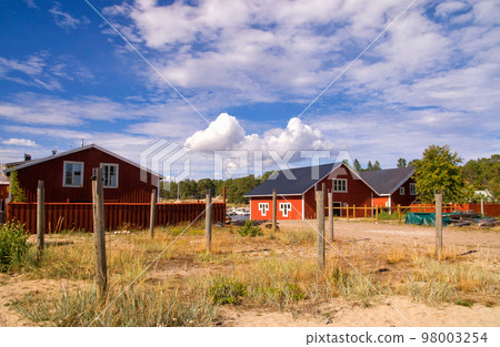 Red painted houses in the fishing village Holick Red painted houses in the fishing village Holick 98003254