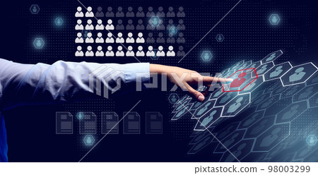 Hand reaches for a holographic scoreboard with employees on a dark blue background. Search for a team and talented workers, career growth. 98003299