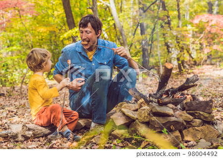 Young woman feeding an African Sacred ibis 98004492