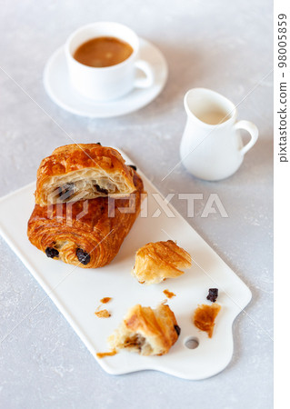 Pain au chocolat, french sweet pastry speciality Pain au chocolat, french sweet pastry speciality 98005859